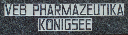 A granite plaque at the first store with the words "VEB pharmaceuticals Königsee", the name of the company after the forced nationalization in East Germany in the 1970s.